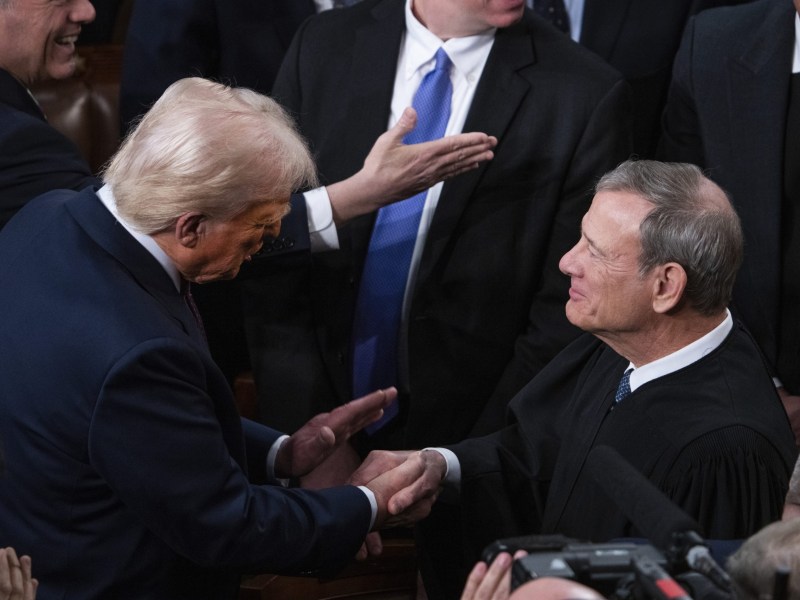 John Roberts greets President Donald Trump before Trump delivered his address to a joint session of Congress in the House Chamber of the U.S. Capitol in March.