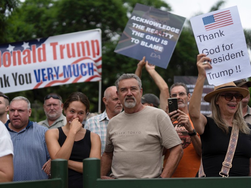 White South Africans demonstrate in support of U.S. President Donald Trump in front of the U.S. embassy in Pretoria, South Africa, Feb. 15, 2025.