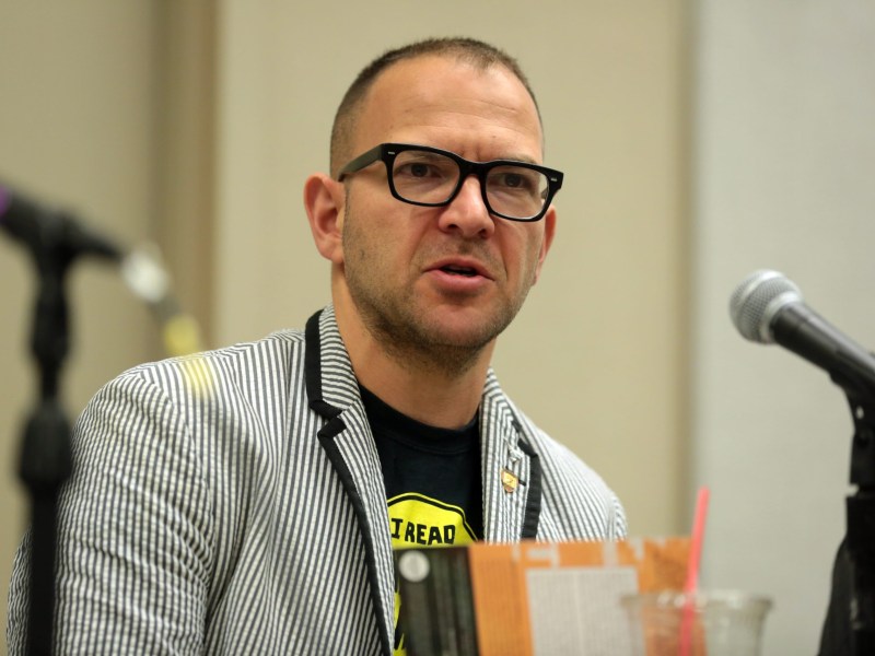 Enshittification Age: Cory Doctorow speaking at the 2018 Phoenix Comic Fest at the Phoenix Convention Center in Phoenix, Arizona.